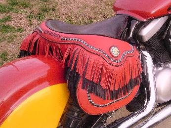 This is our newest solo seat! It's is a 1350 with saddle bags added, or can be removed, if you wish. Call and lets talk about one for your bike.